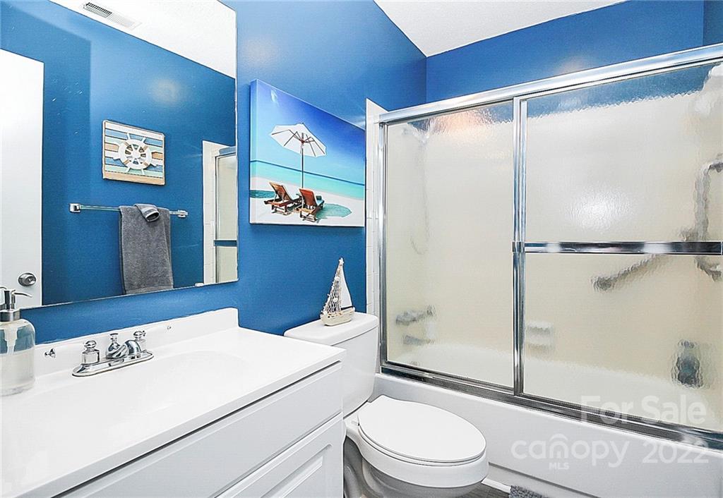 1612 Sharon Road West Charlotte, NC 28210 - Photo 24 of 25 a bathroom with a sink a toilet and shower