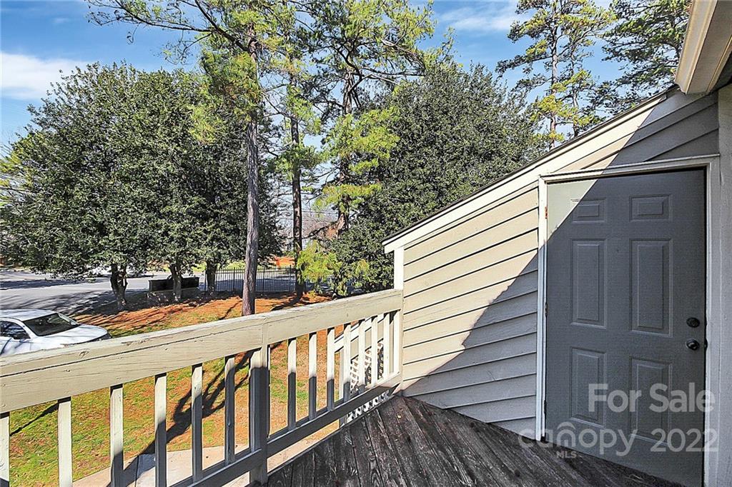1612 Sharon Road West Charlotte, NC 28210 - Photo 25 of 25 a view of a balcony with wooden fence and floor