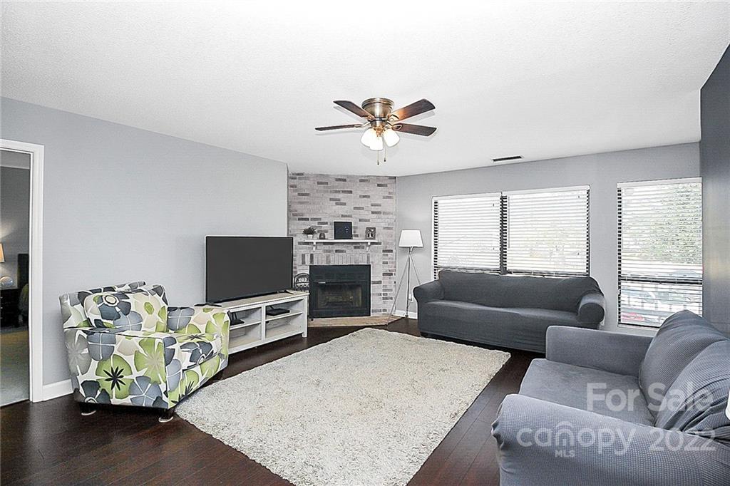 1612 Sharon Road West Charlotte, NC 28210 - Photo 7 of 25 a living room with furniture and a flat screen tv