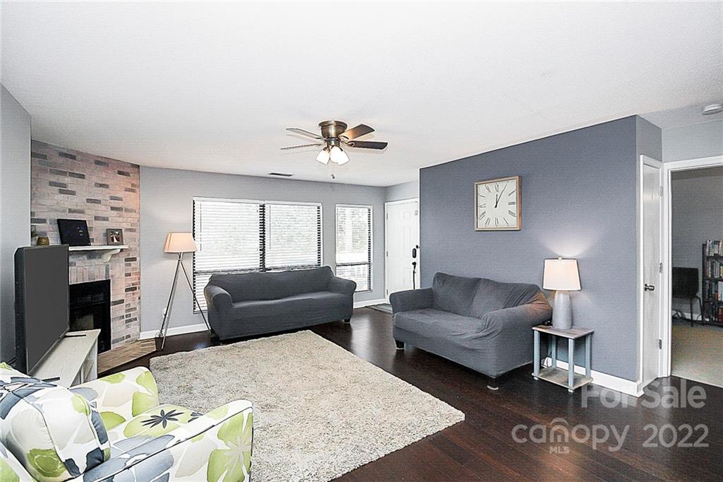 1612 Sharon Road West Charlotte, NC 28210 - Photo 8 of 25 a living room with furniture and a flat screen tv