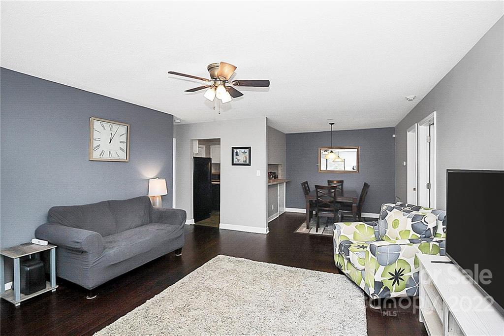 1612 Sharon Road West Charlotte, NC 28210 - Photo 9 of 25 a living room with fireplace furniture and a flat screen tv