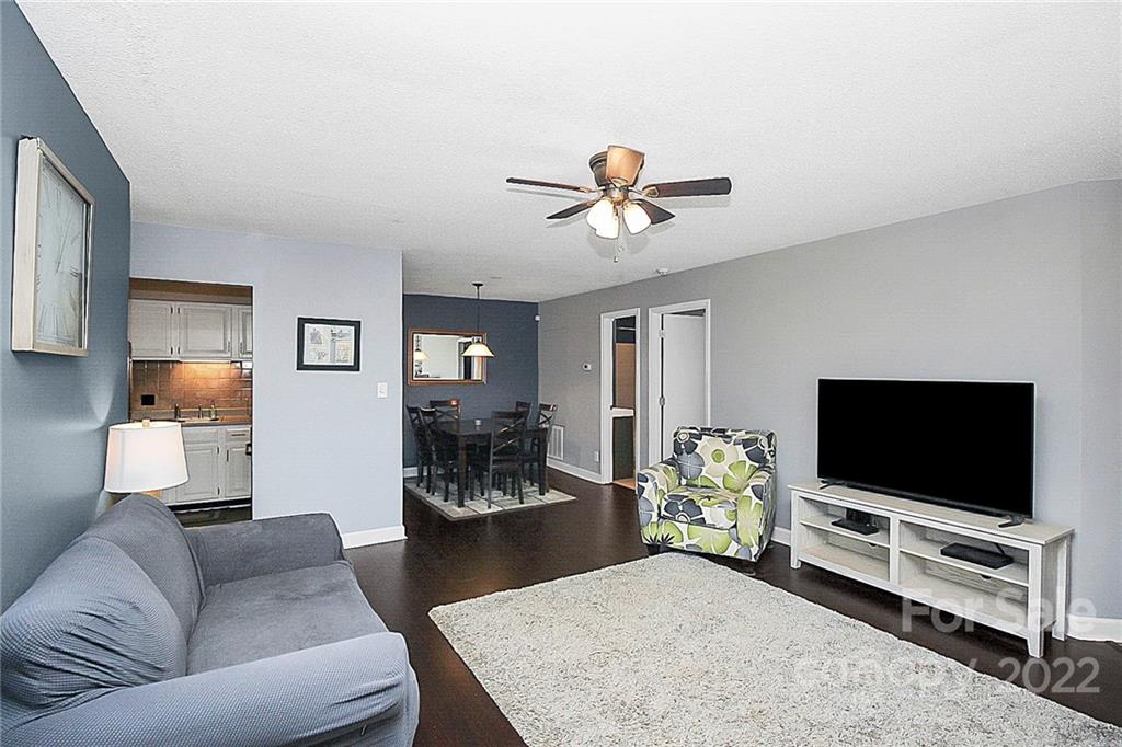 1612 Sharon Road West Charlotte, NC 28210 - Photo 10 of 25 a living room with furniture and a flat screen tv