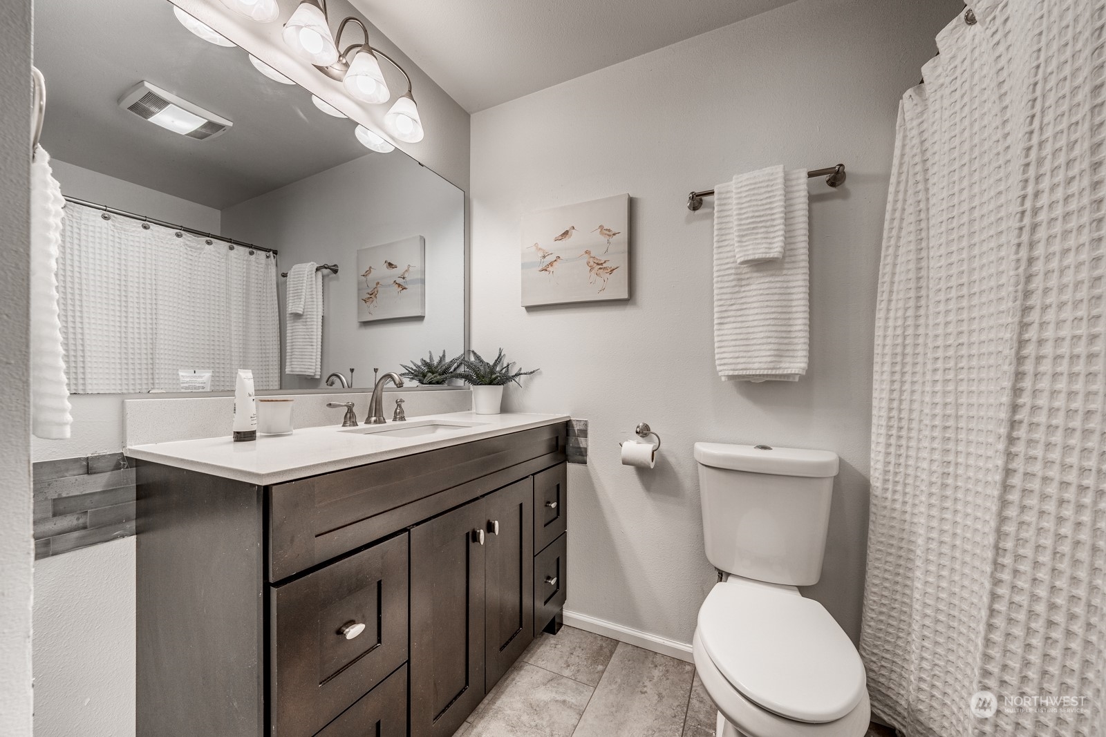 8512 242nd Street Southwest, Unit 9 Edmonds, WA 98026 - Photo 18 of 26 a bathroom with a toilet sink and mirror