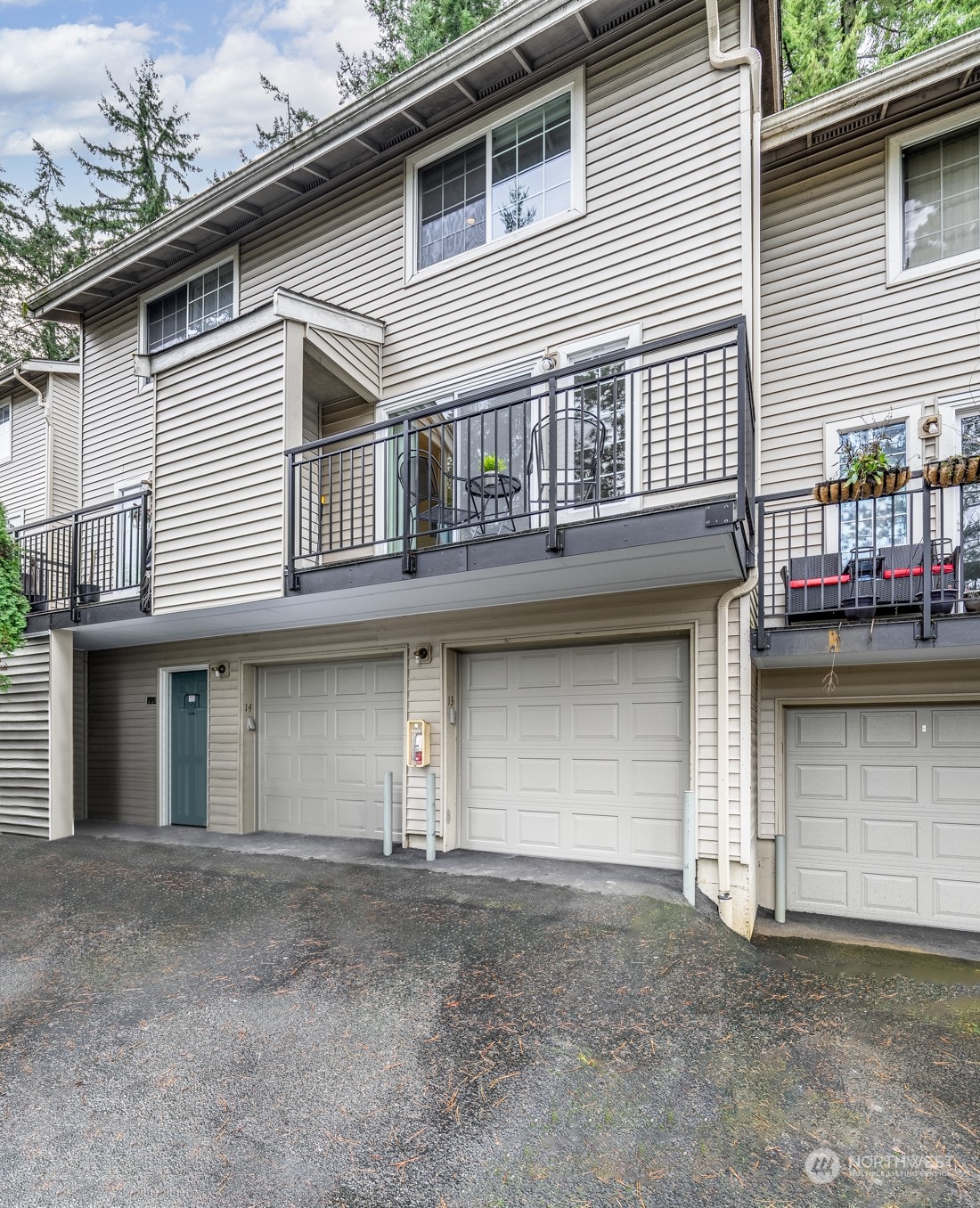 8512 242nd Street Southwest, Unit 9 Edmonds, WA 98026 - Photo 2 of 26 a front view of a house with balcony