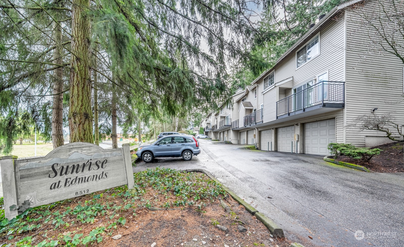 8512 242nd Street Southwest, Unit 9 Edmonds, WA 98026 - Photo 25 of 26 a white house that has a sign on it
