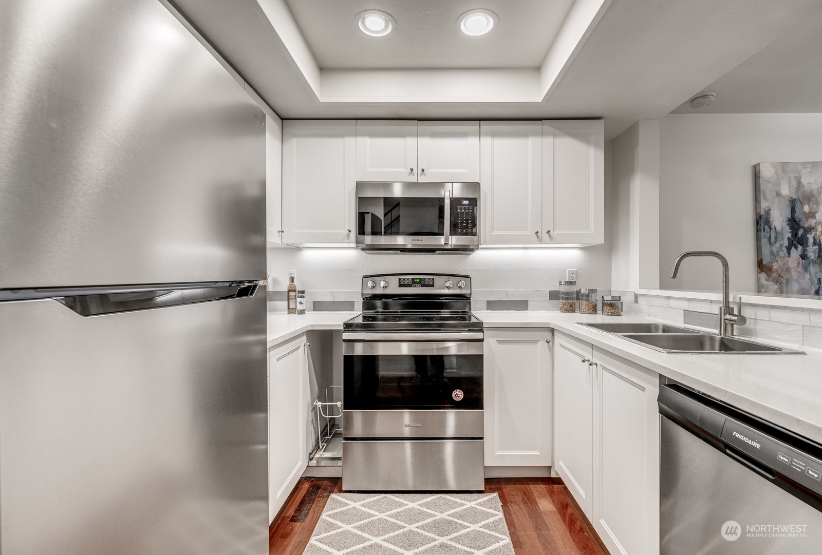 8512 242nd Street Southwest, Unit 9 Edmonds, WA 98026 - Photo 5 of 26 a kitchen with a sink and stainless steel appliances