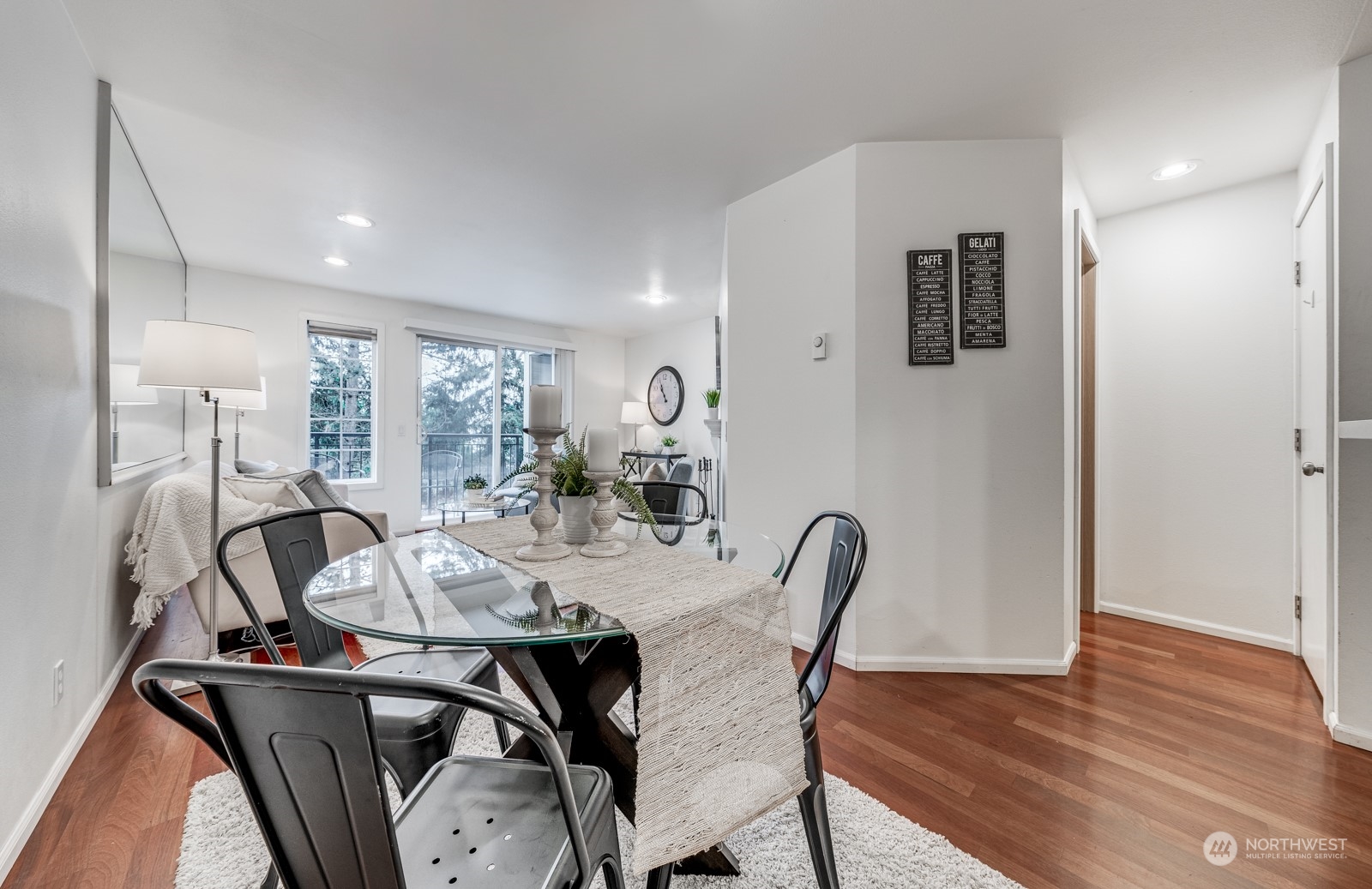8512 242nd Street Southwest, Unit 9 Edmonds, WA 98026 - Photo 10 of 26 a view of a dining room with furniture and wooden floor