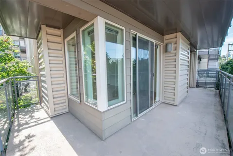 a view of front door and porch with a yard