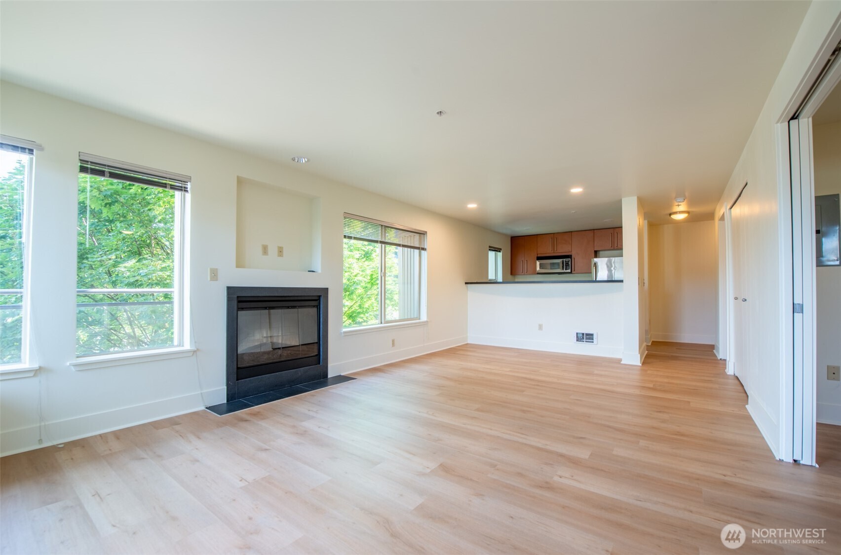 1550 Eastlake Avenue East, Unit 201 Seattle, WA 98102 - Photo 11 of 30 a view of empty room with a fireplace and window