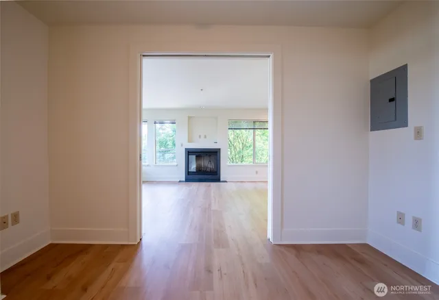 wooden floor in an empty room with a window