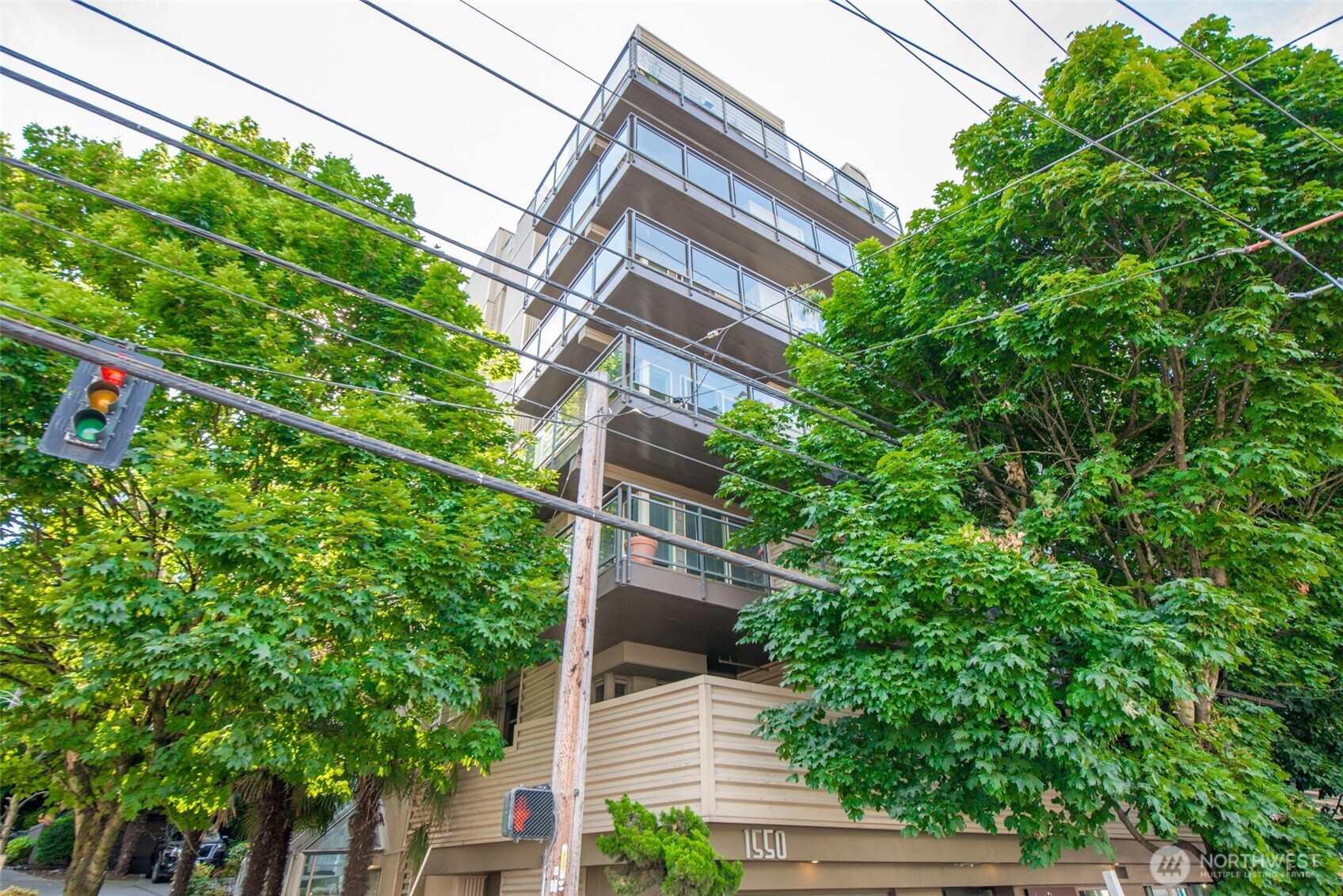 1550 Eastlake Avenue East, Unit 201 Seattle, WA 98102 - Photo 24 of 30 a view of a house with a tree