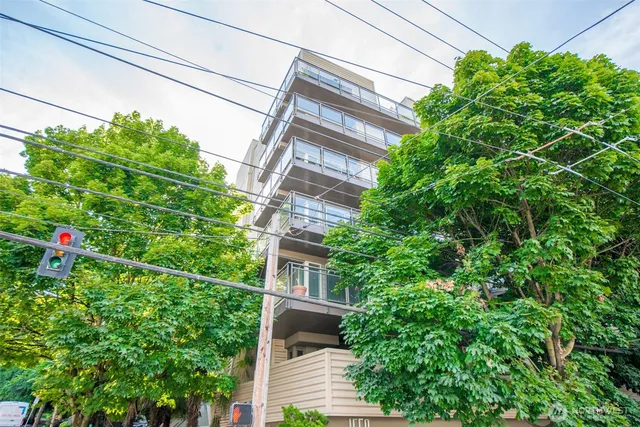 front view of a building with a garden