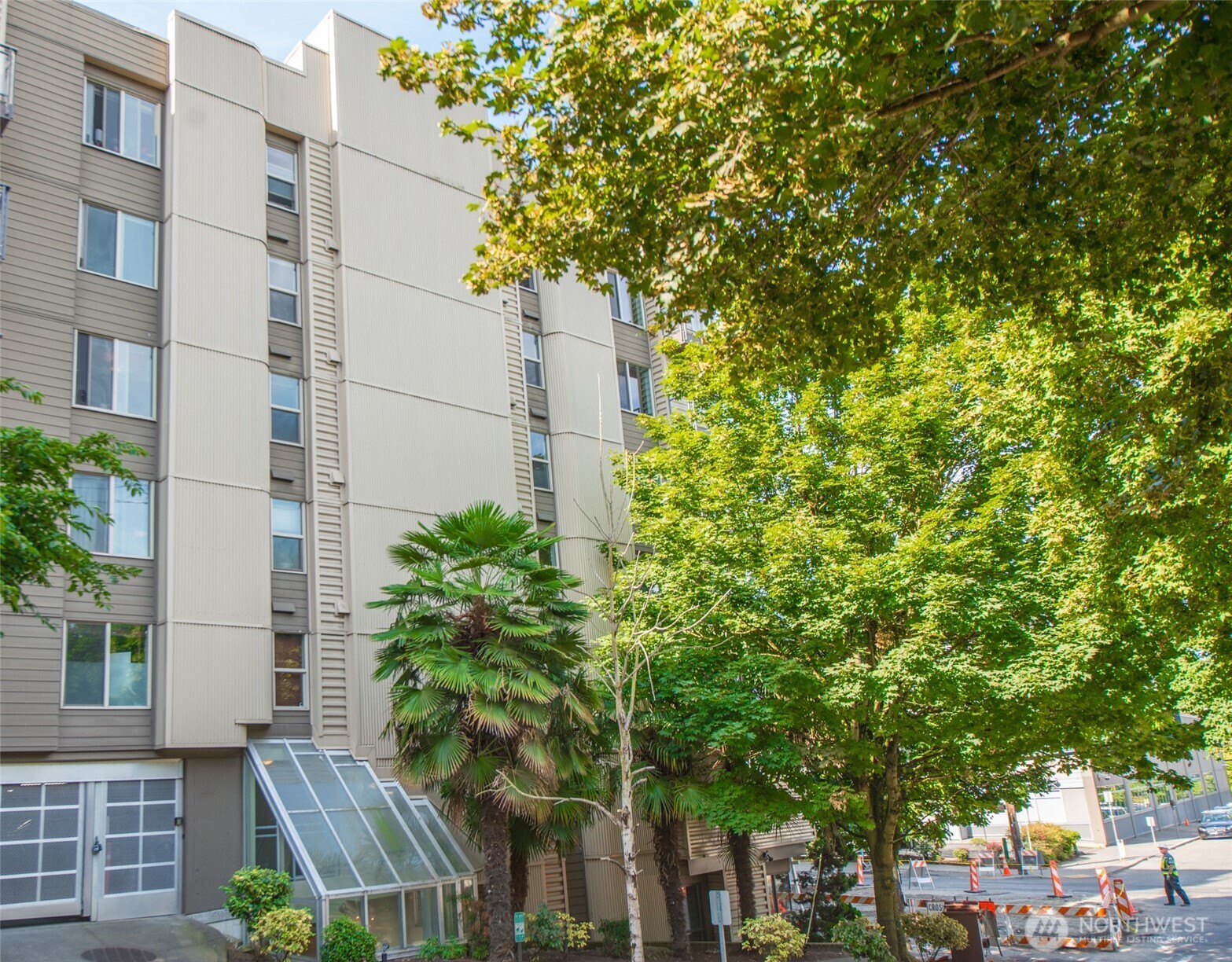 1550 Eastlake Avenue East, Unit 201 Seattle, WA 98102 - Photo 28 of 30 a view of a tall building with a tree in front of it