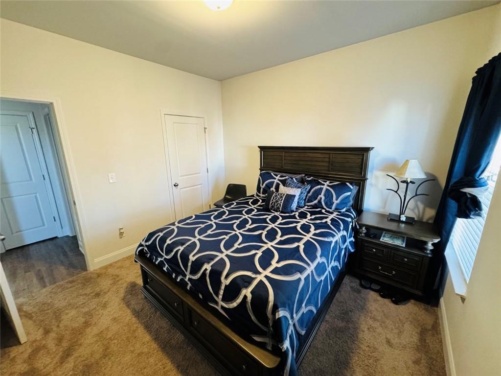142 Wentworth Lane Villa Rica, GA 30180 - Photo 18 of 44 a bedroom with a bed and a window