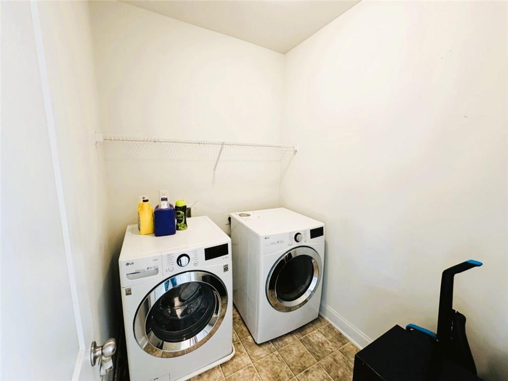 142 Wentworth Lane Villa Rica, GA 30180 - Photo 24 of 44 a utility room with dryer and washer