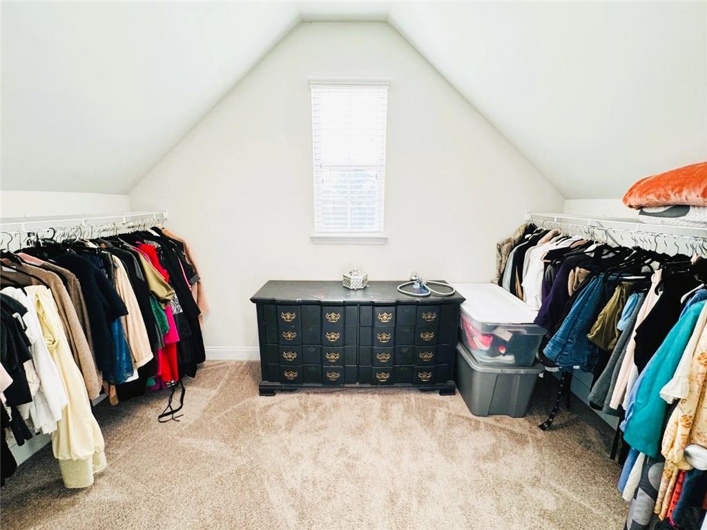 142 Wentworth Lane Villa Rica, GA 30180 - Photo 28 of 44 a view of walk in closet with clothes and shoes