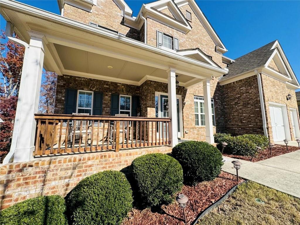 142 Wentworth Lane Villa Rica, GA 30180 - Photo 4 of 44 a view of a house with large windows and a table and chairs