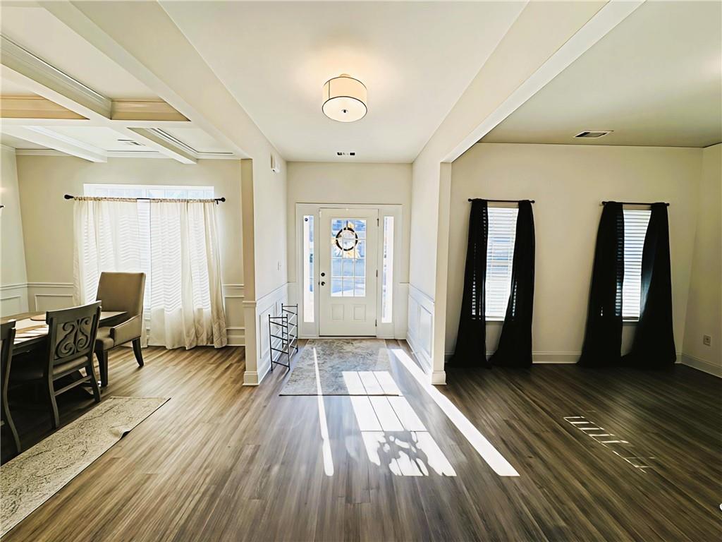 142 Wentworth Lane Villa Rica, GA 30180 - Photo 5 of 44 a view of a hallway with wooden floor and furniture