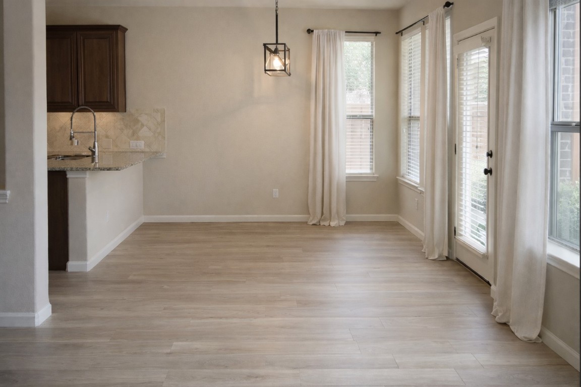 2612 Raindance Leander, TX 78641 - Photo 3 of 8 a view of hallway with wooden floor