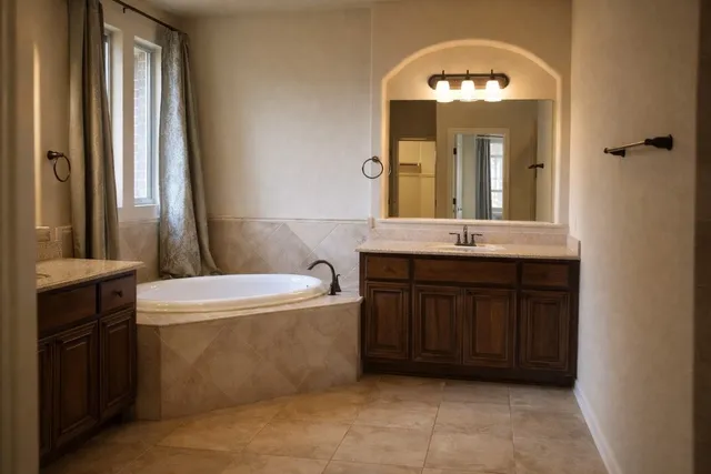 a bathroom with a granite countertop sink a toilet and a mirror