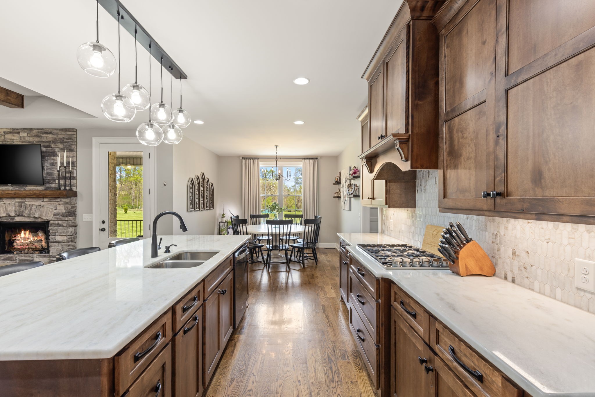 6012 Bethlehem Road Springfield, TN 37172 - Photo 12 of 60 a kitchen with cabinets a stove and a wooden floors