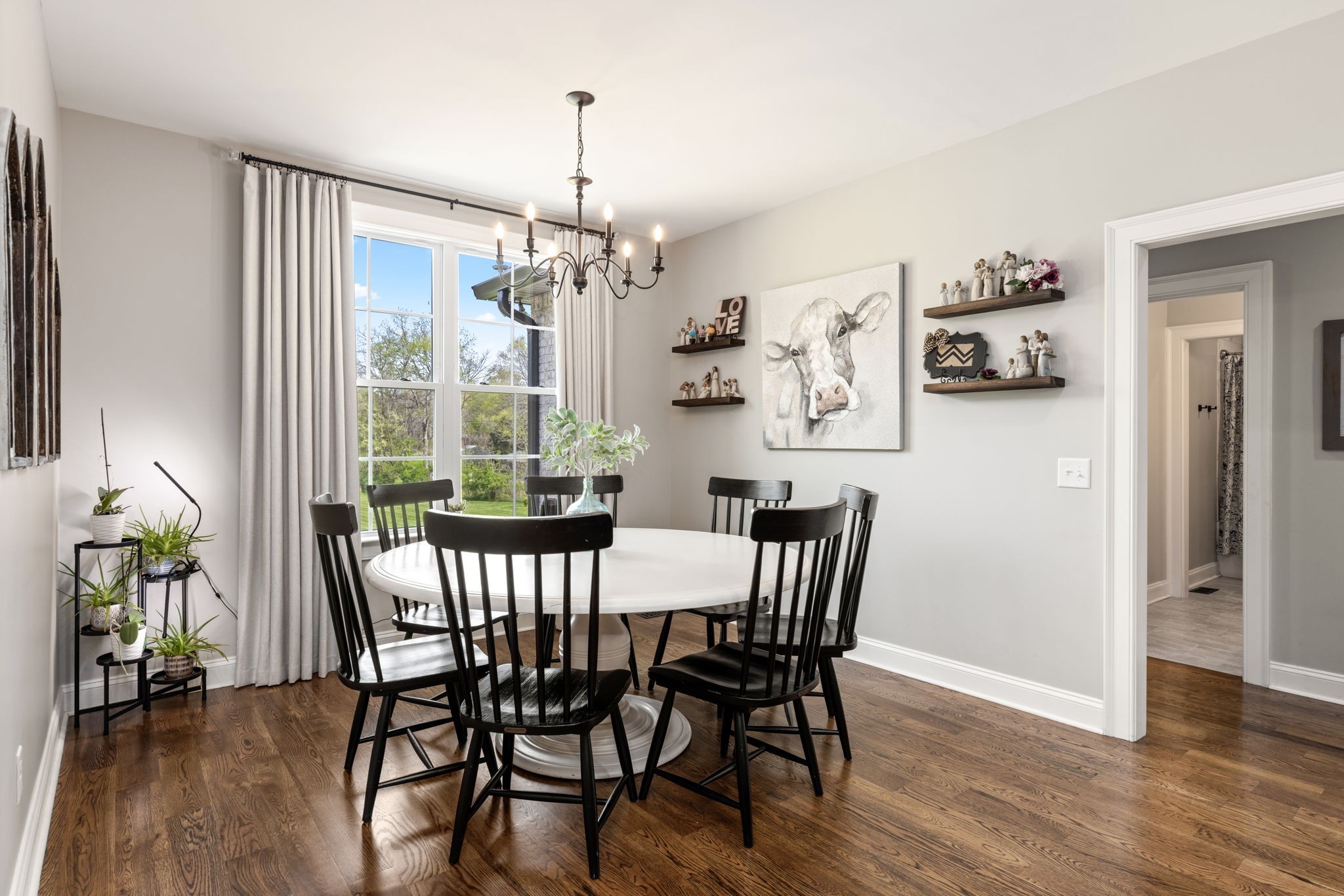6012 Bethlehem Road Springfield, TN 37172 - Photo 14 of 60 a view of a dining room with furniture wooden floor and chandelier
