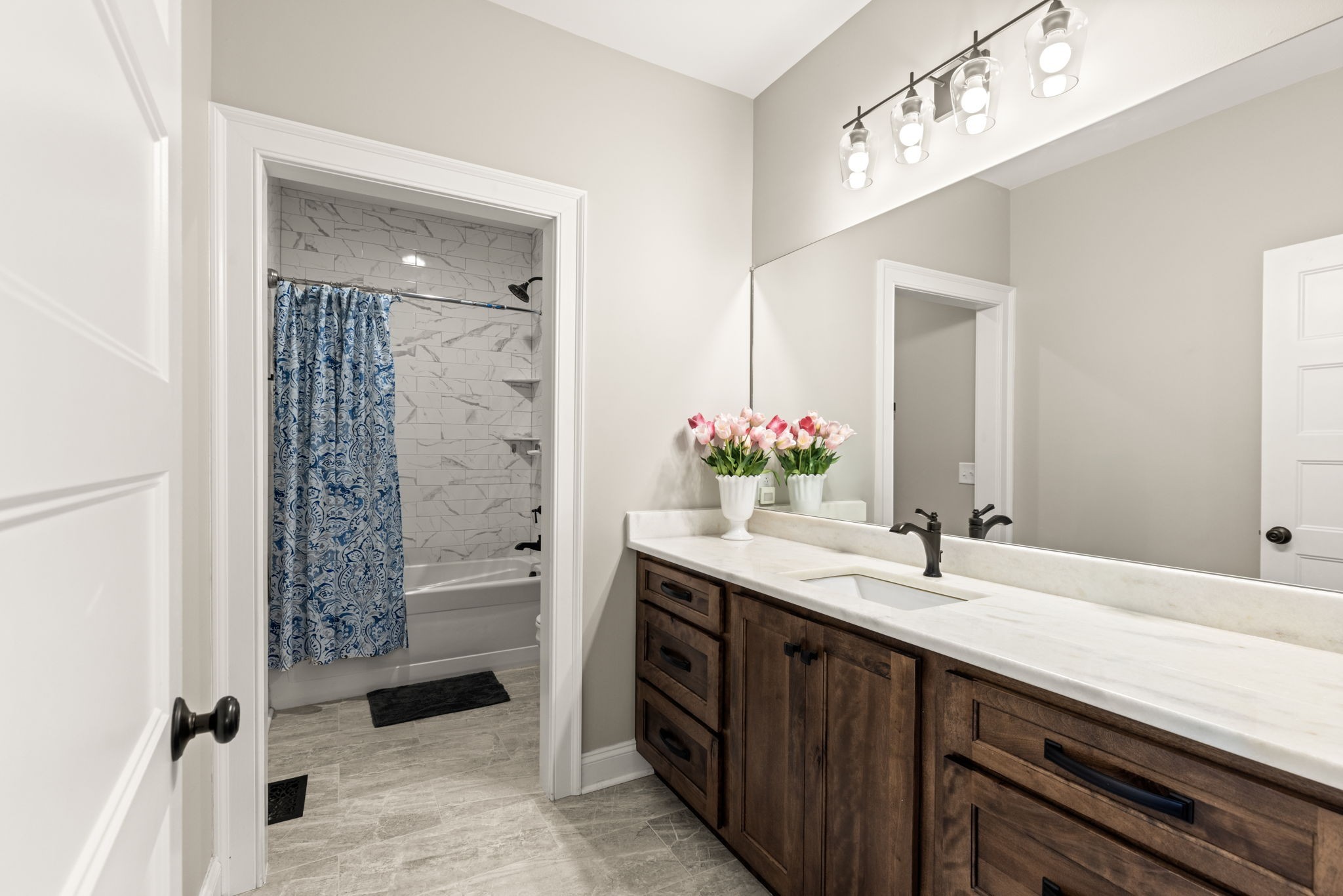 6012 Bethlehem Road Springfield, TN 37172 - Photo 26 of 60 a bathroom with a sink double vanity and a shower