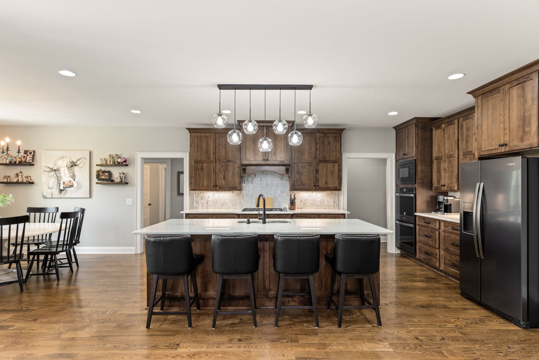 6012 Bethlehem Road Springfield, TN 37172 - Photo 3 of 60 a kitchen with refrigerator dining table and chairs