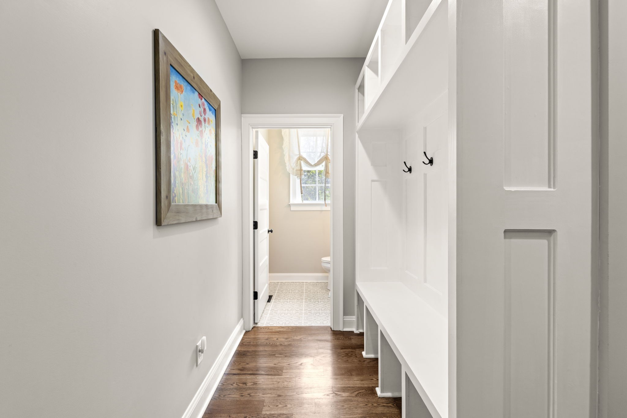 6012 Bethlehem Road Springfield, TN 37172 - Photo 32 of 60 a view of a hallway with wooden floor and staircase