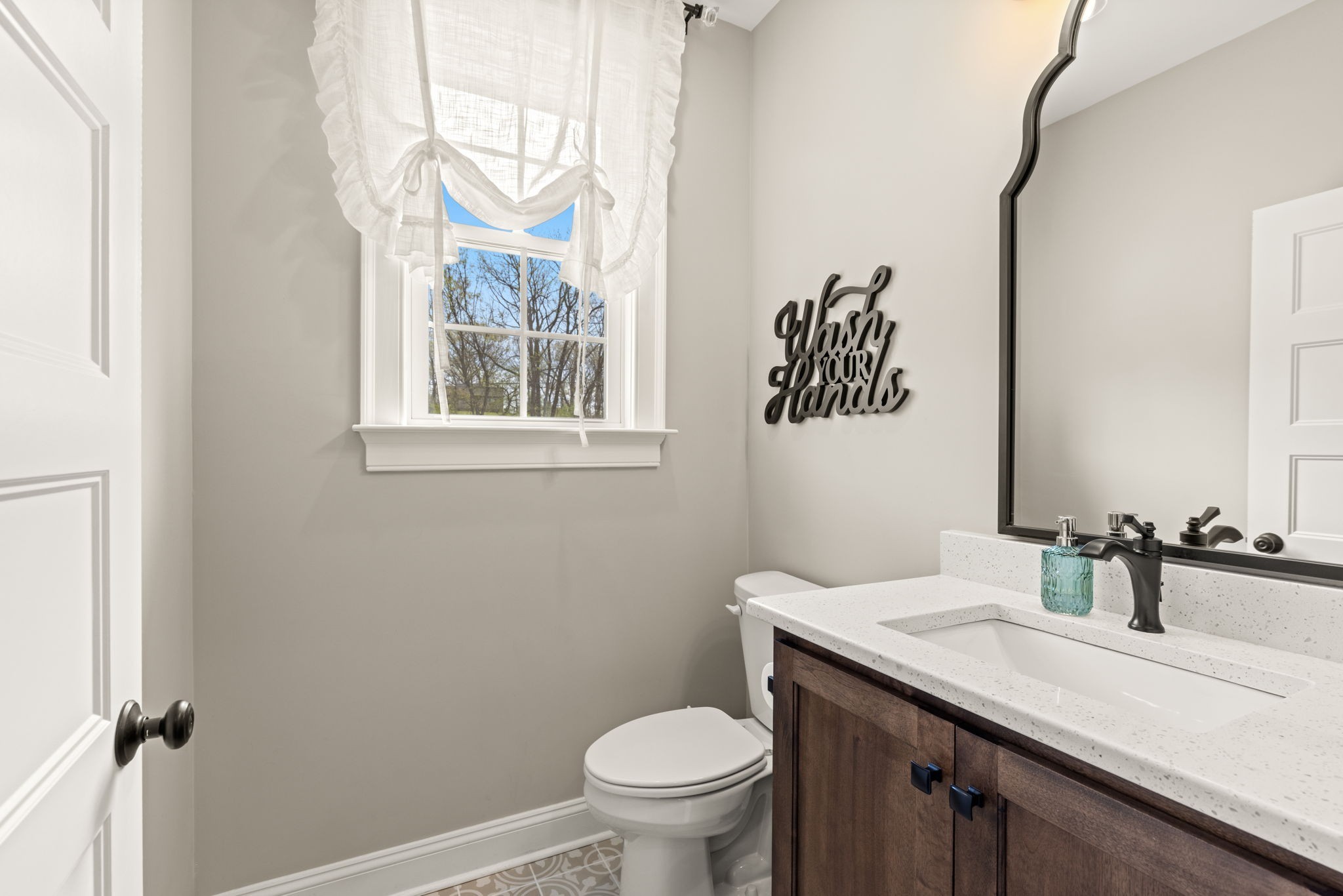 6012 Bethlehem Road Springfield, TN 37172 - Photo 33 of 60 a bathroom with a sink a toilet and a mirror