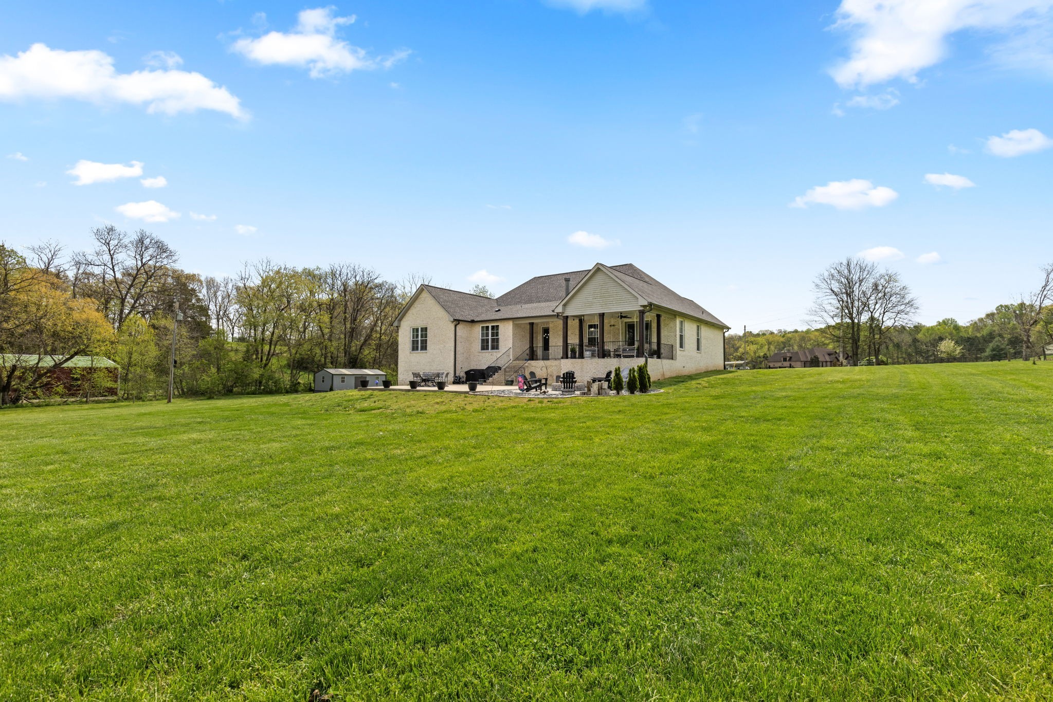6012 Bethlehem Road Springfield, TN 37172 - Photo 55 of 60 a view of a big house with a big yard and large trees