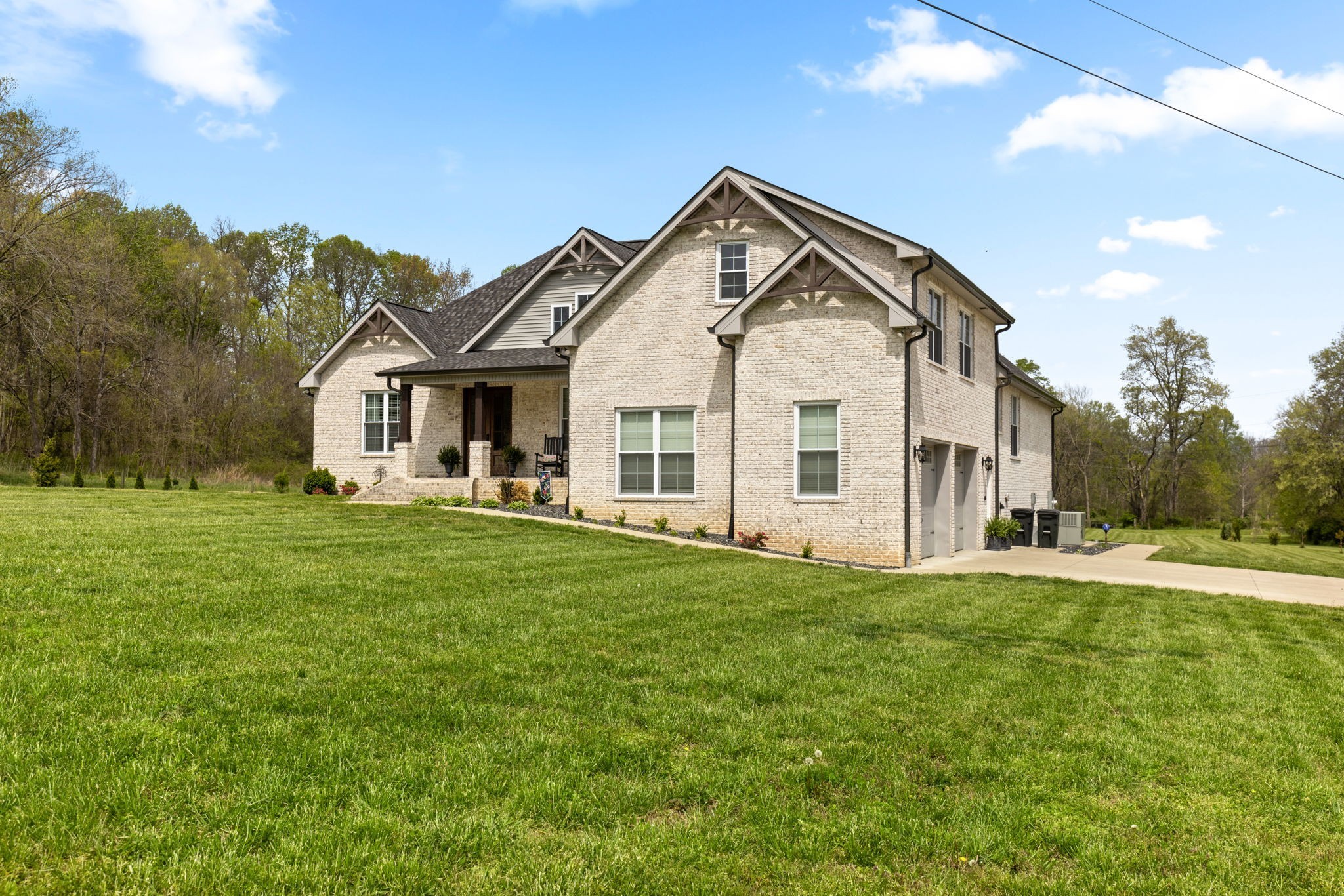 6012 Bethlehem Road Springfield, TN 37172 - Photo 57 of 60 a view of a white house in front of a big yard with large trees