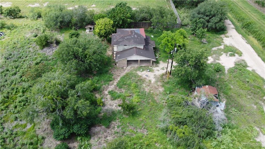1524 West Hi Line Road Pharr, TX 78577 - Photo 23 of 34 an aerial view of a house with a yard and lake view