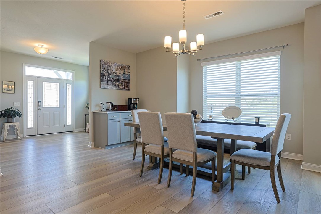 5013 Arena Court Hamilton, OH 45011 - Photo 9 of 41 This bright and open dining area offers seamless flow, perfect for gathering and entertaining.