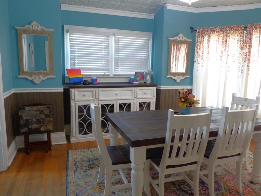 703 Gay Street Menard, TX 76859 - Photo 13 of 37 a view of a dining room with furniture and window