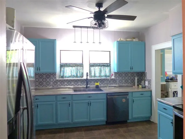a kitchen with a stove and a microwave