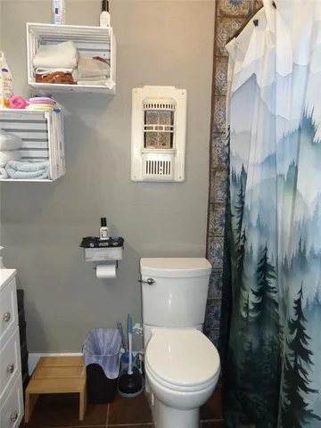 a bathroom with a toilet a sink and a bathtub