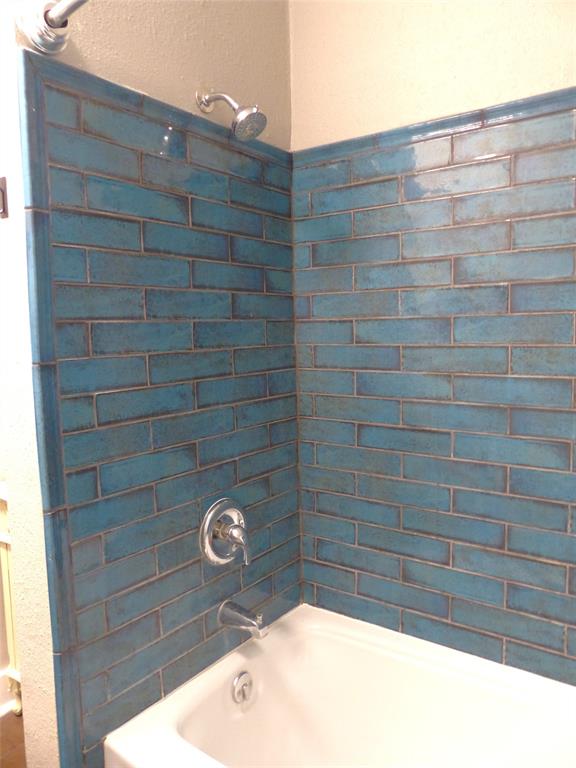 703 Gay Street Menard, TX 76859 - Photo 26 of 37 a bathroom with a shower