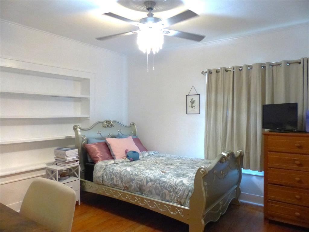 703 Gay Street Menard, TX 76859 - Photo 30 of 37 a bedroom with a bed and a flat screen tv