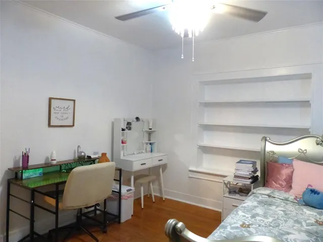 a bedroom with furniture and a window