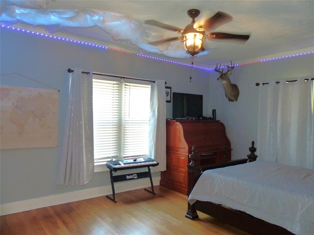 703 Gay Street Menard, TX 76859 - Photo 33 of 37 a bedroom with furniture and a window