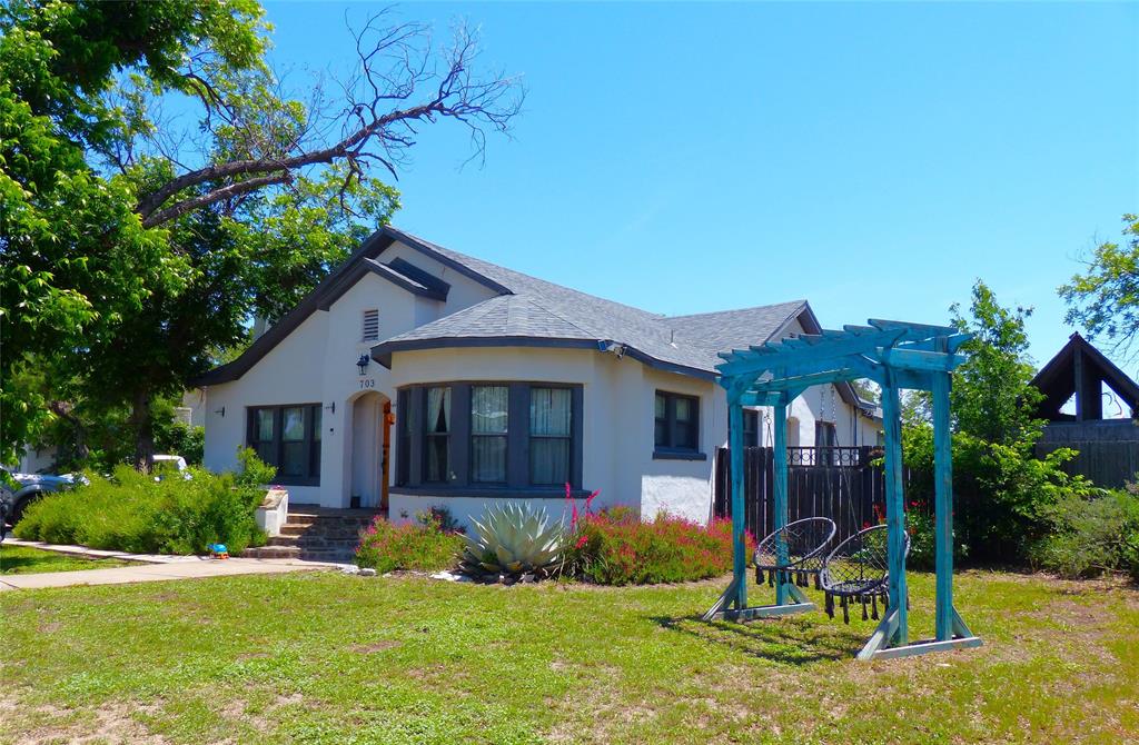 703 Gay Street Menard, TX 76859 - Photo 5 of 37 a view of a house with a yard