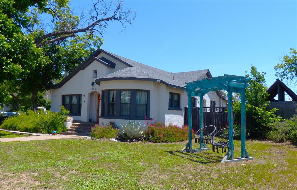 703 Gay Street Menard, TX 76859 - Photo 6 of 37 a house view with a garden space