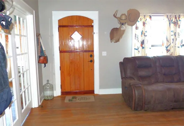 a view of a livingroom with furniture and windows