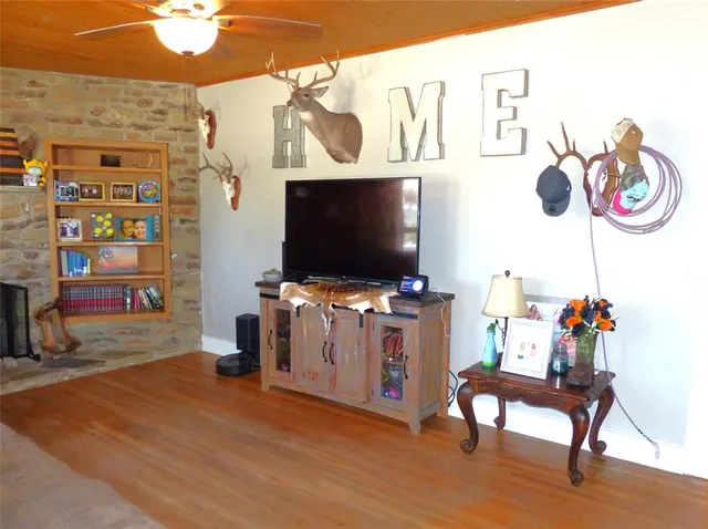 a living room with furniture and a flat screen tv