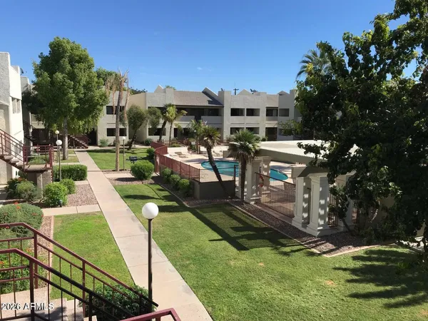 a view of a swimming pool with a patio
