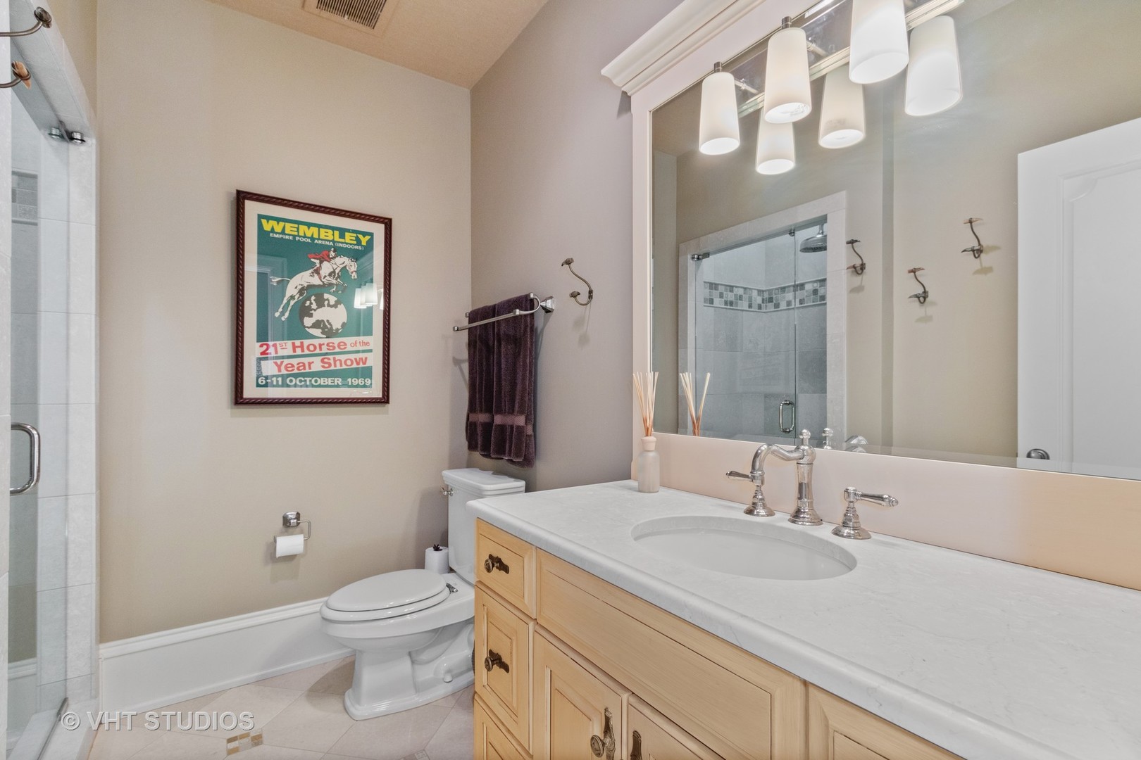 1291 Elm Tree Road Lake Forest, IL 60045 - Photo 25 of 56 a bathroom with a toilet sink and mirror