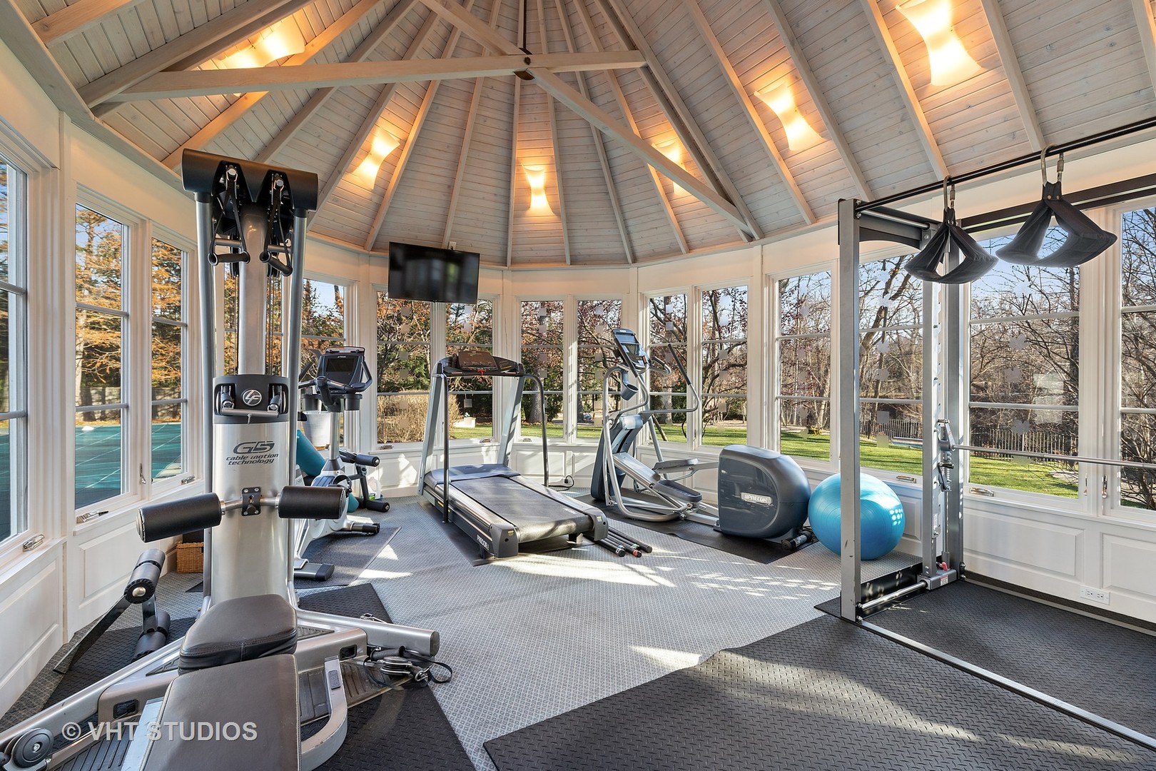 1291 Elm Tree Road Lake Forest, IL 60045 - Photo 34 of 56 a view of a room with gym equipment and large windows