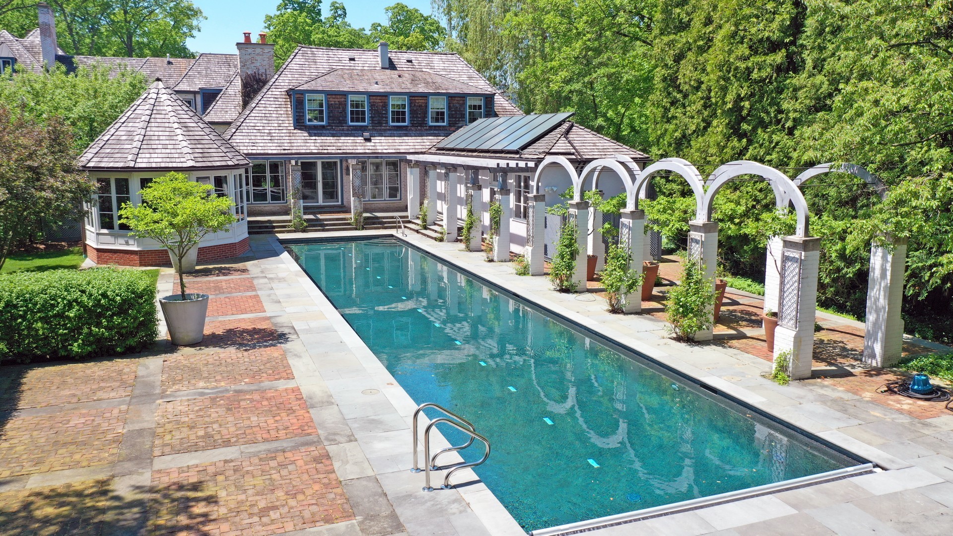 1291 Elm Tree Road Lake Forest, IL 60045 - Photo 35 of 56 a view of swimming pool with outdoor seating and plants
