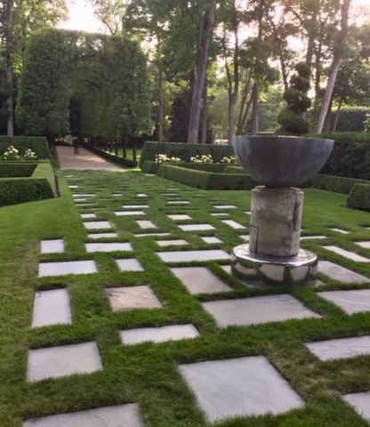 1291 Elm Tree Road Lake Forest, IL 60045 - Photo 44 of 56 a view of a fountain in a yard with plants and large trees